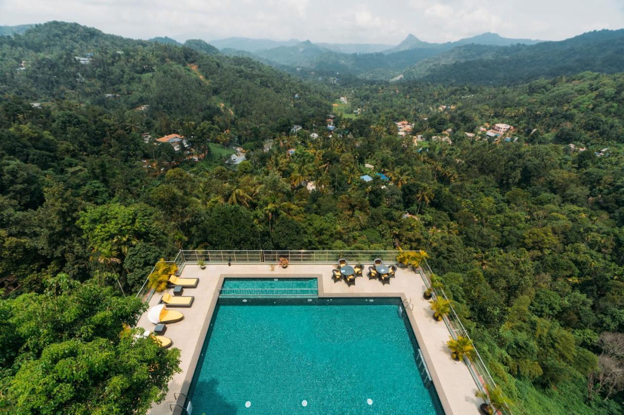 The Panoramic Getaway Hotel Munnar Exterior photo Aerial view of the swimming pool at the hotel