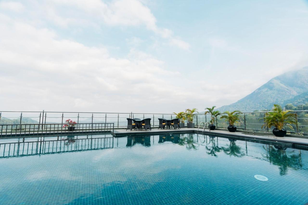 The Panoramic Getaway Hotel Munnar Exterior photo The swimming pool at the top of the hotel