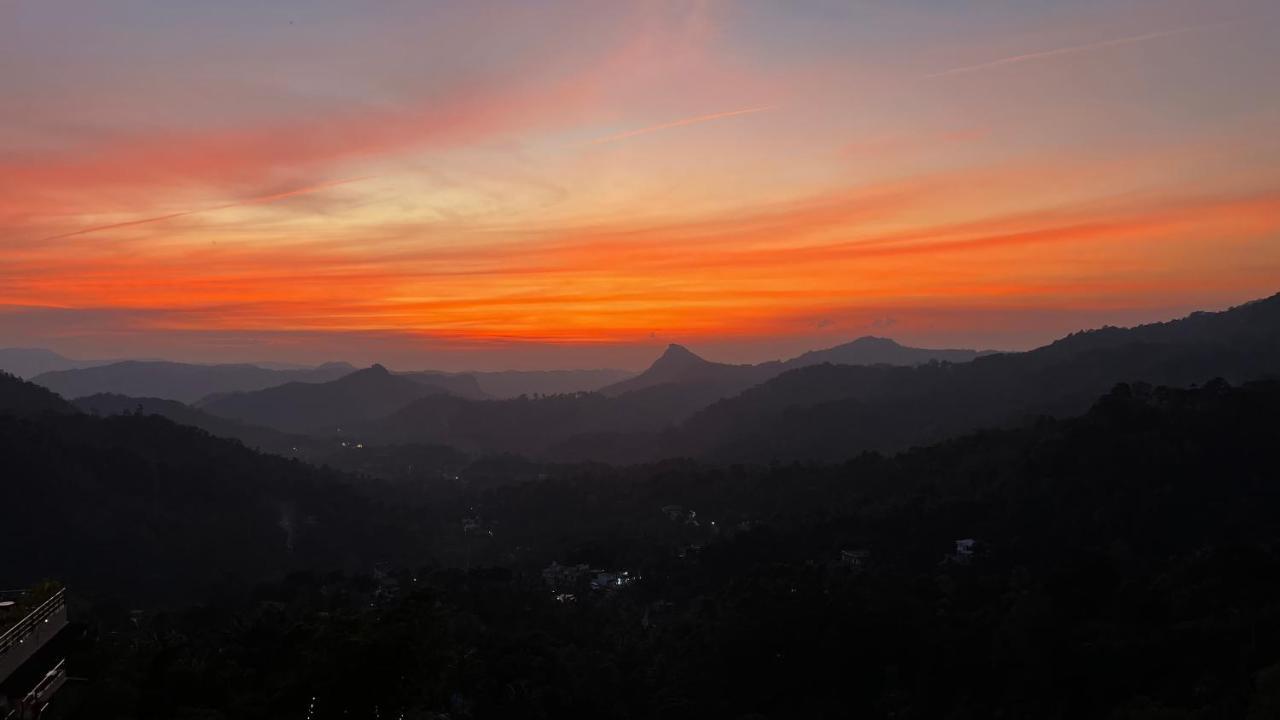 The Panoramic Getaway Hotel Munnar Exterior photo Sunset over the Santa Monica Mountains