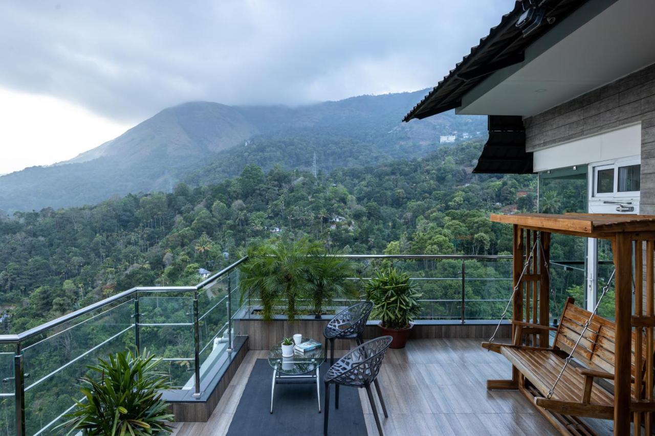 The Panoramic Getaway Hotel Munnar Exterior photo View of the mountain from the balcony of a house in the village