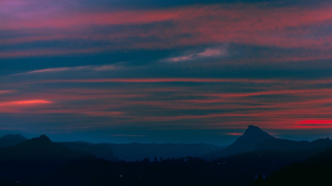 The Panoramic Getaway Hotel Munnar Exterior photo Sunset over the Sierra de los Caracoles