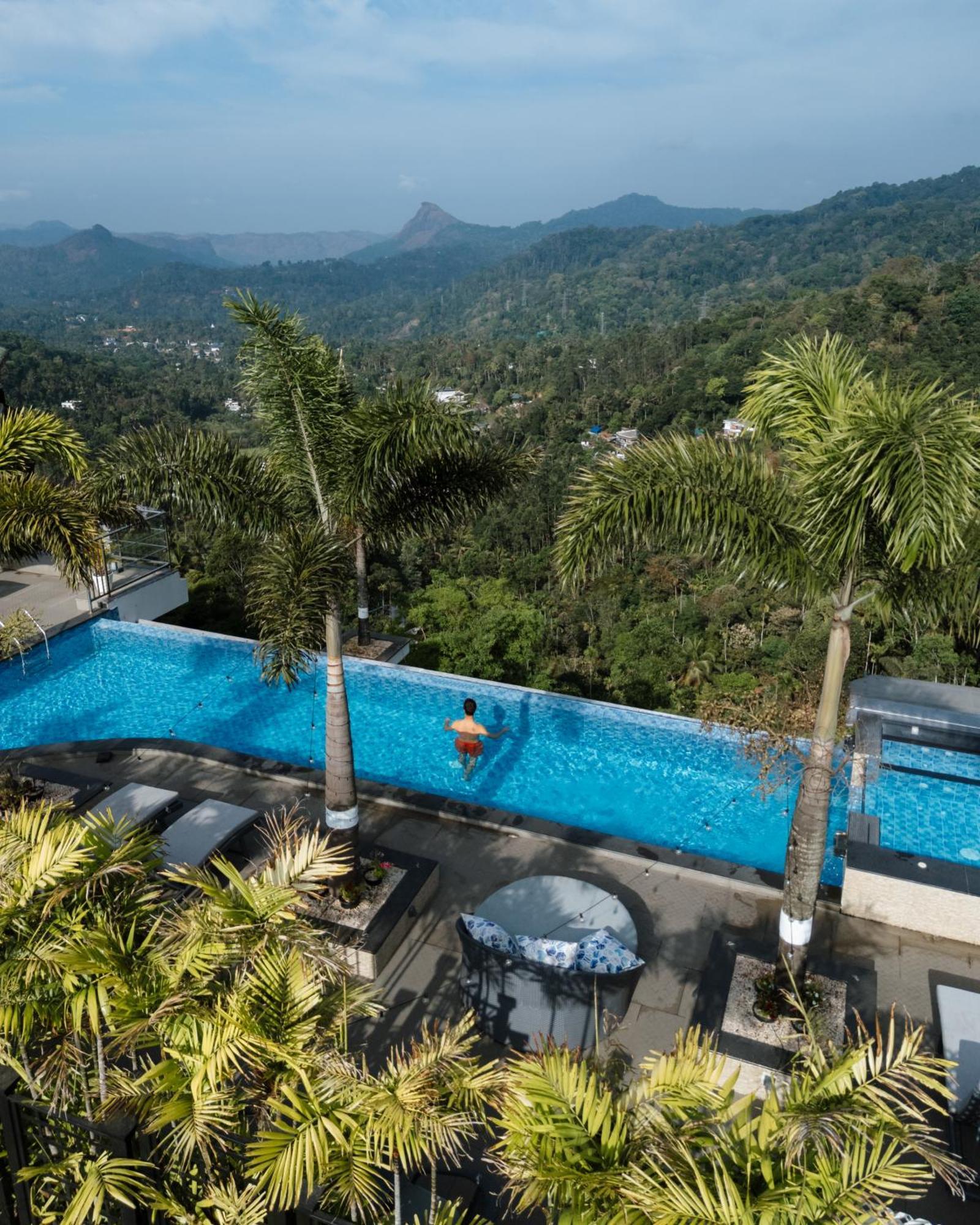 The Panoramic Getaway Hotel Munnar Exterior photo Infinity pool at the Le Méridien, Phuket Resort & Spa