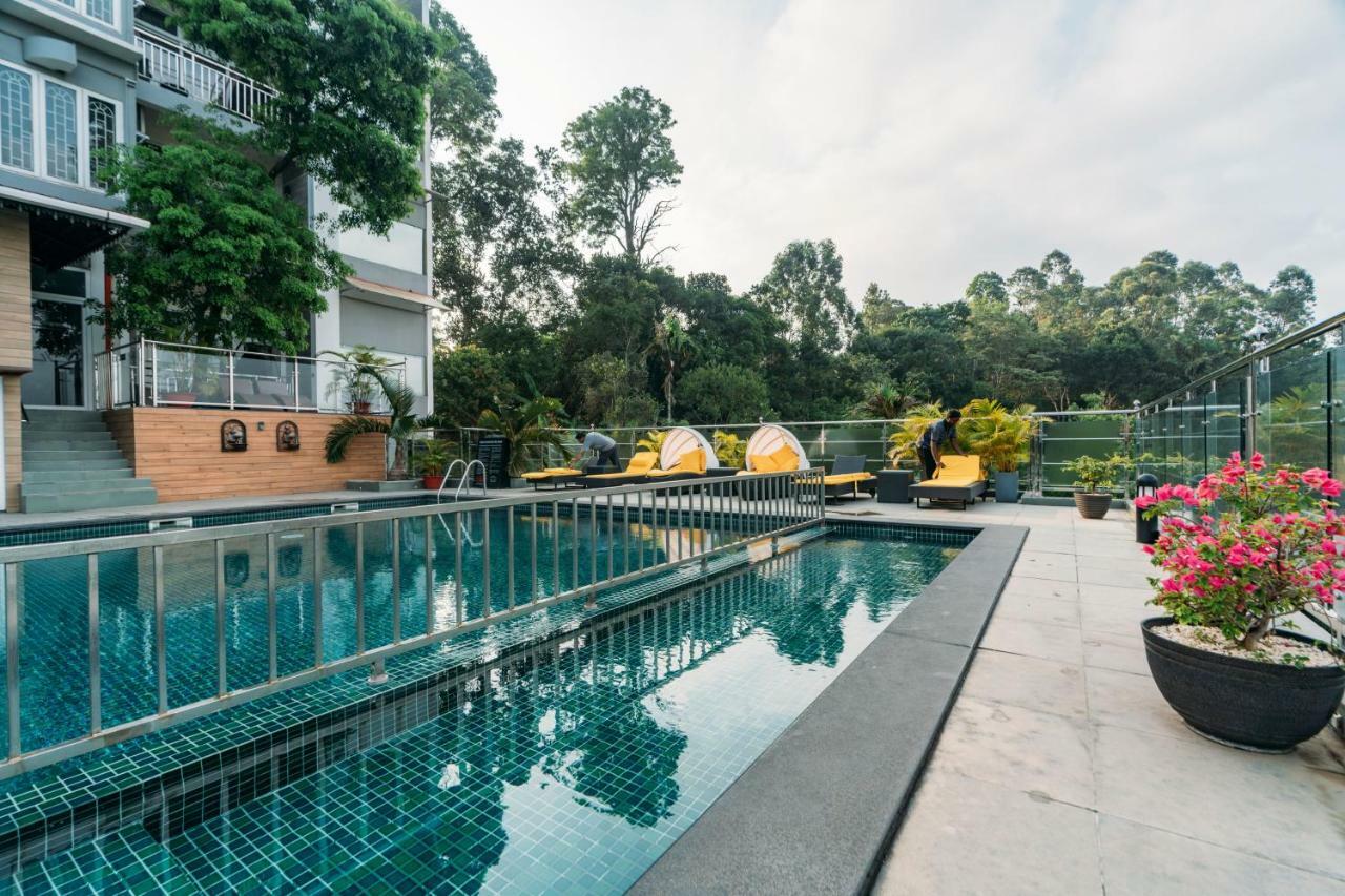 The Panoramic Getaway Hotel Munnar Exterior photo The swimming pool at the hotel